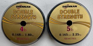 Image of retail packs of fishing tackle - Drennan Double Strength 100m spools available in 4lb or 5lb breaking strains.