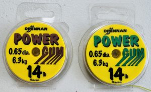 Image of a retail packs of fishing tackle - Drennan Power Gum 10m spools 14lb Breaking Strain in Brown or Green.