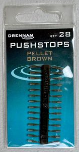Image of a retail pack of fishing tackle – Drennan Pushstops Pellet Brown, 28 per pack.
