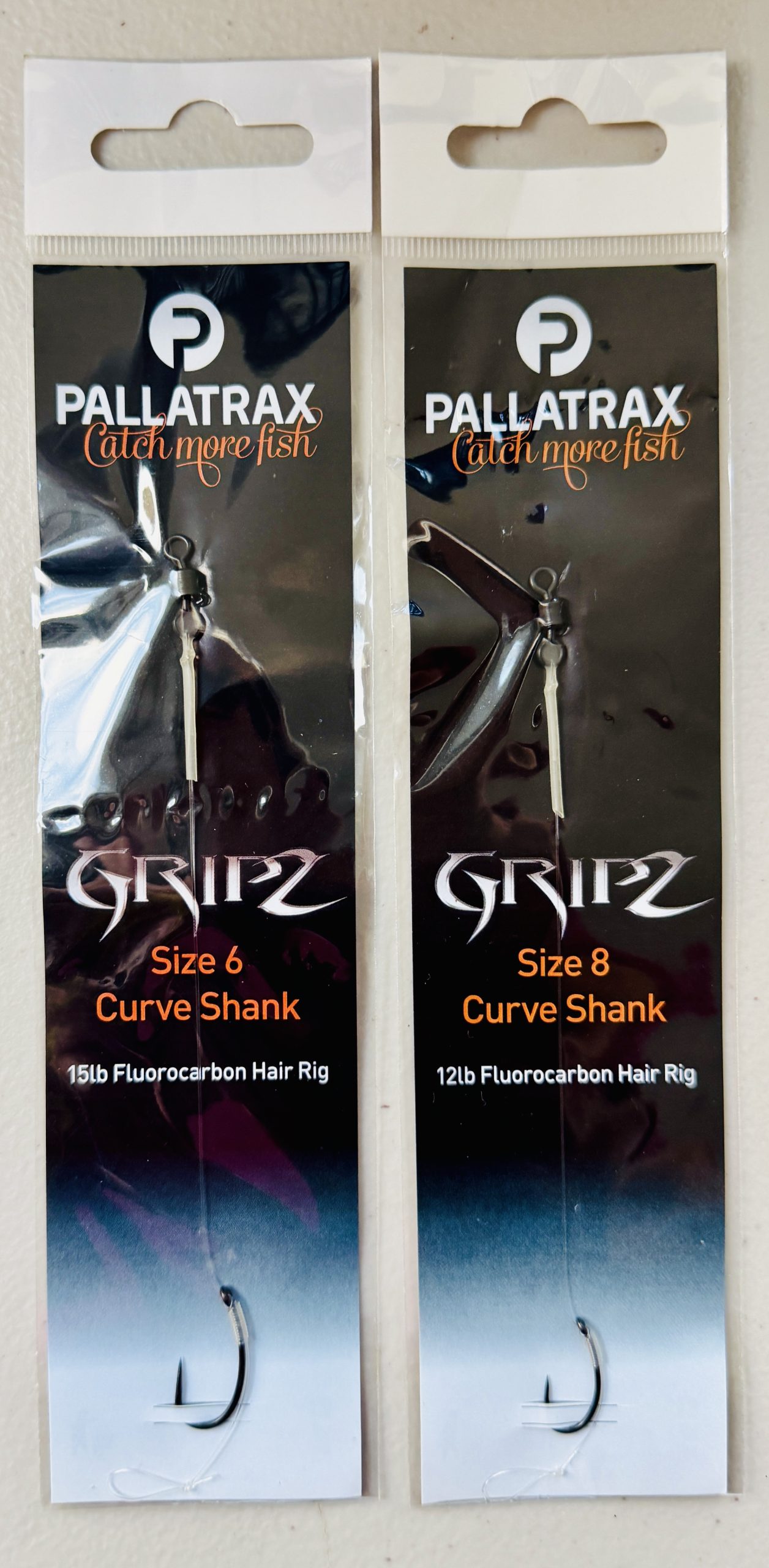 Image showing 2 packs of Pallatrax Gripz Curve Shank Fluorocarbon Carp Hair Rigs in Size 6 and Size 8.