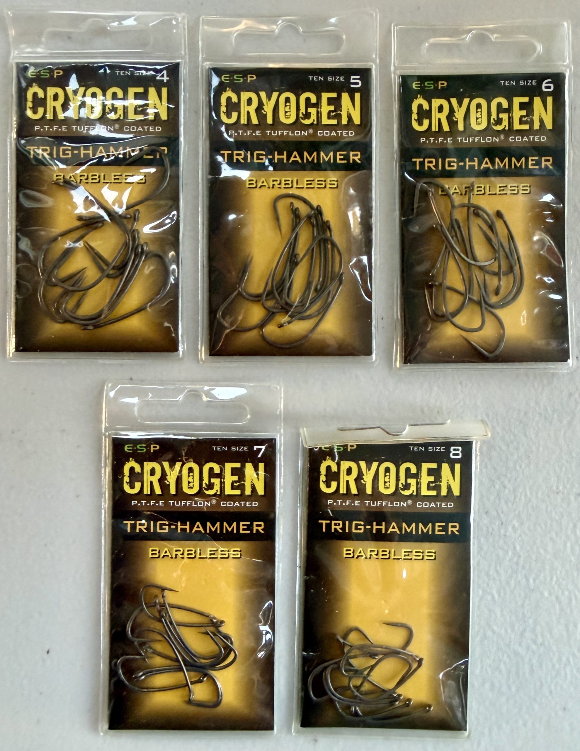 Image showing 5 retail packs of ESP Cryogen Trig Hammer Barbless Carp Hooks in Size 4, 5, 6, 7 and 8.